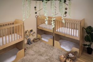Loose parts play area with pine cones and wicker baskets