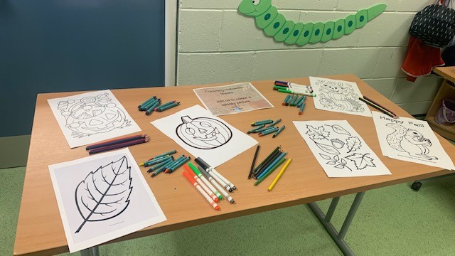Child engaging in autumn arts and crafts