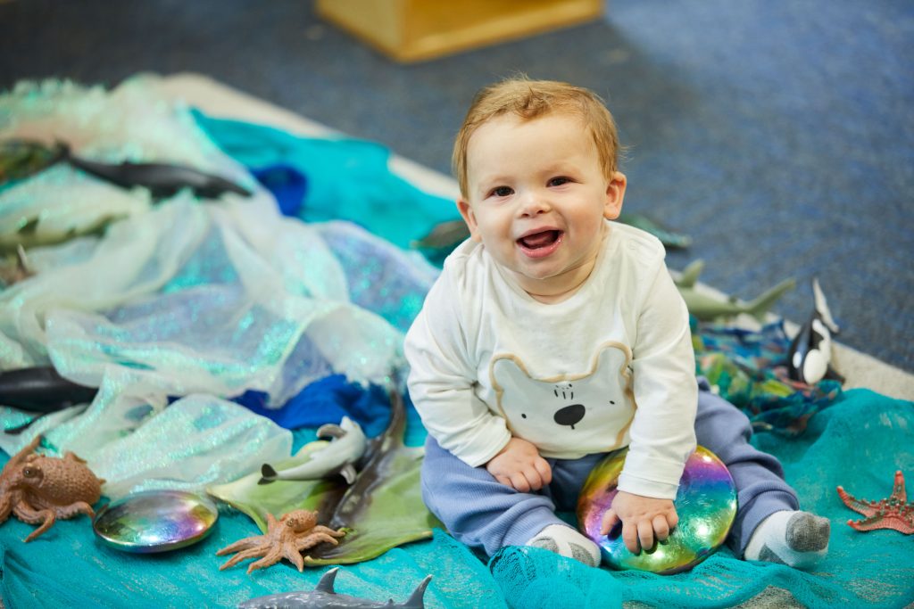 Baby engaging in sensory play