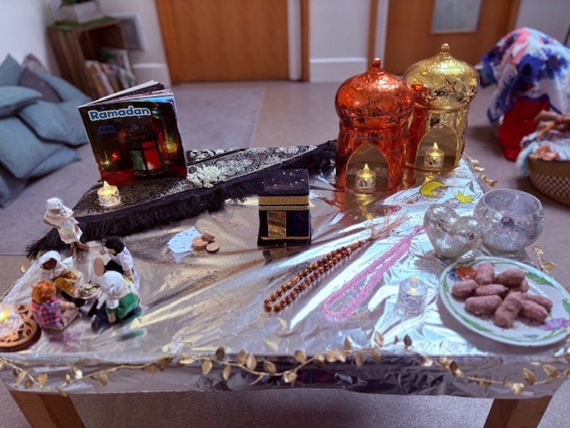 Kids Planet Bradmore Road Celebrating Ramadan with a table of traditional treats and educational information.