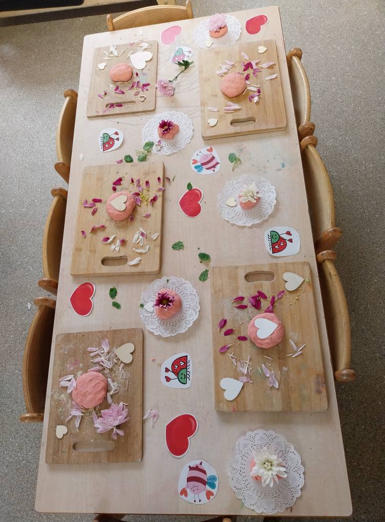 Playdough activity table with hearts and petals