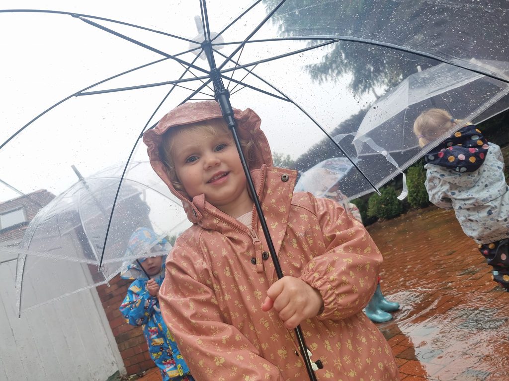 Children enjoying autumn outdoor play at Kids Planet