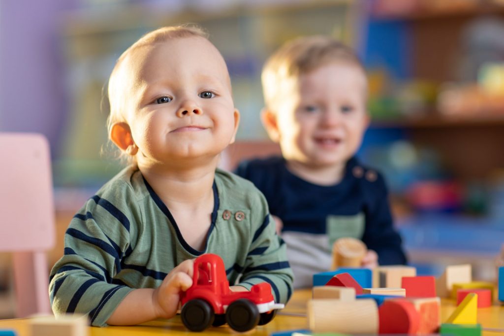 toddlers playing inside at nursery
