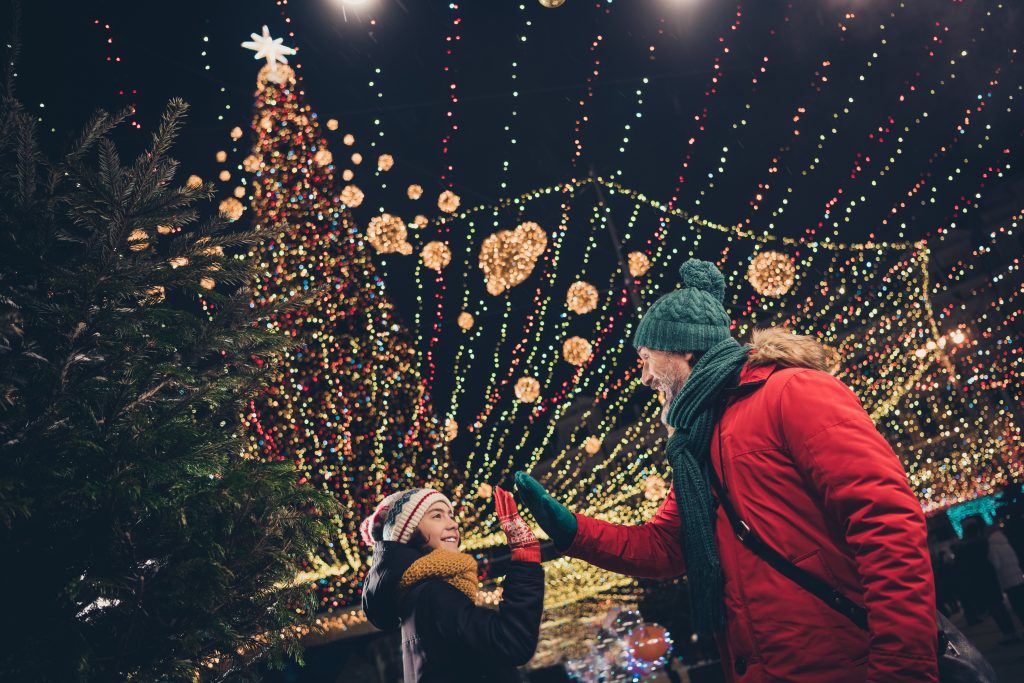 Father and son sharing a high five outdoors