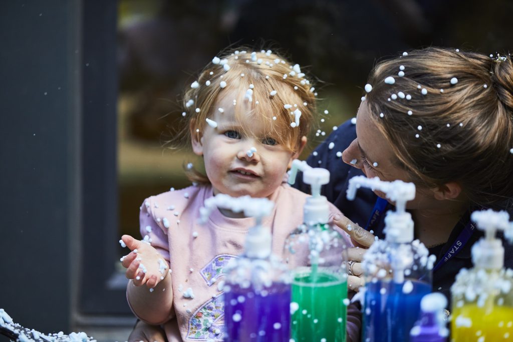 Toddler's playing outside on a rainy day